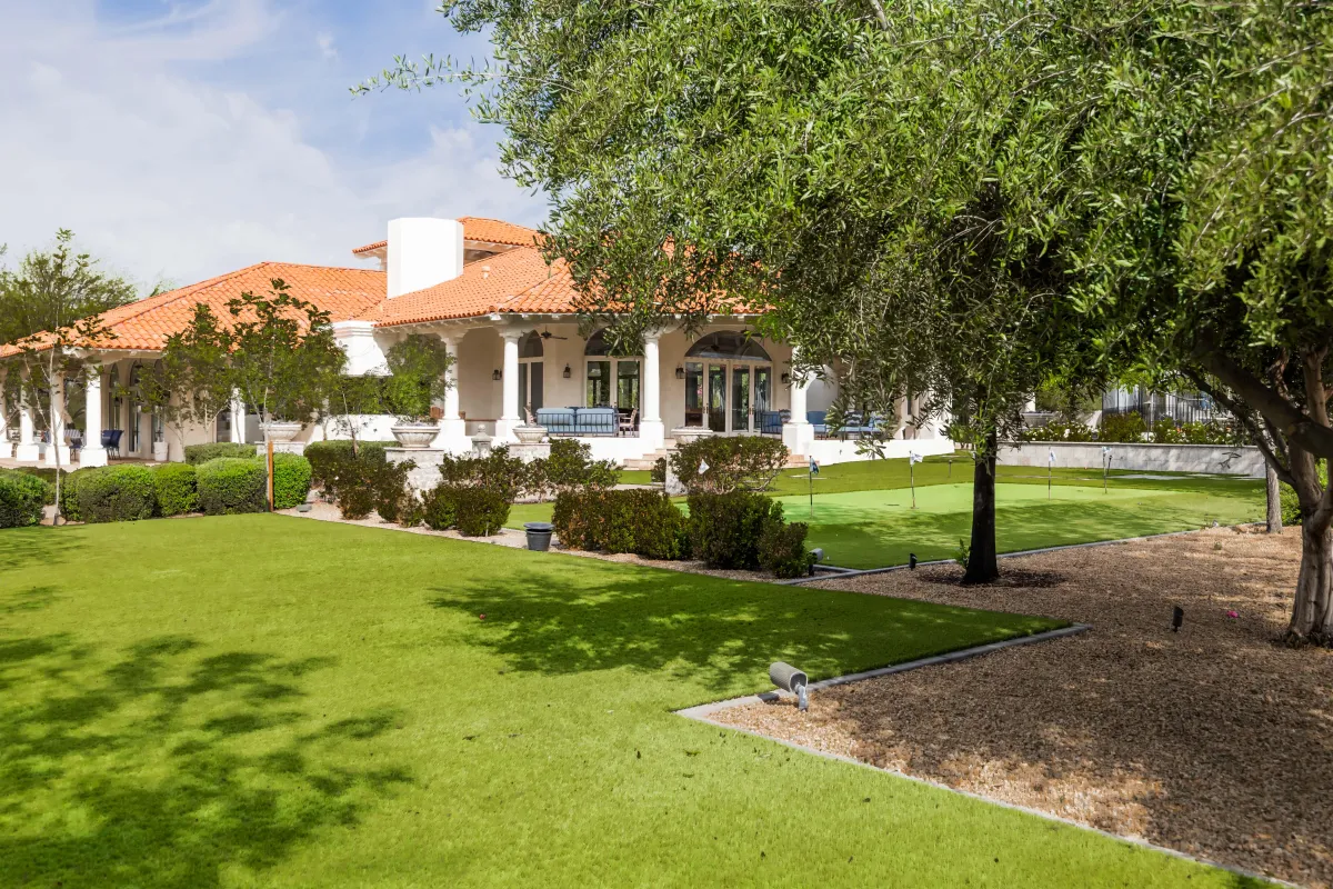 Putting green with lush landscaping