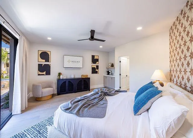 Master bedroom with a king-size bed and a luxurious ensuite bathroom