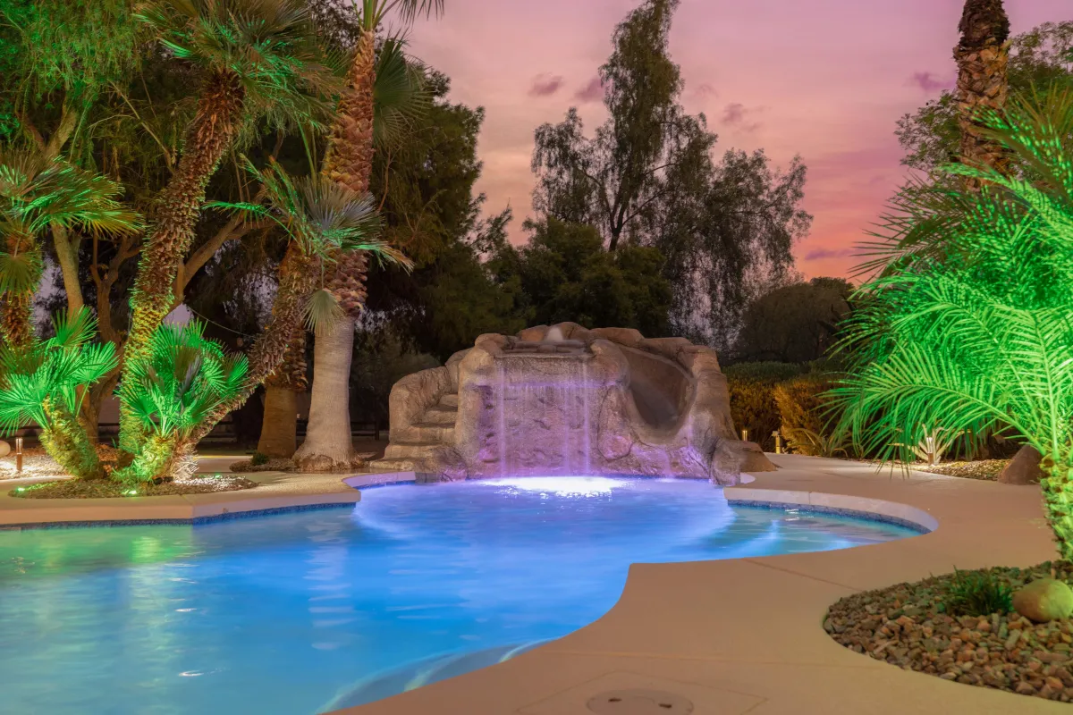 Private pool surrounded by lush landscaping at Paradise Palms