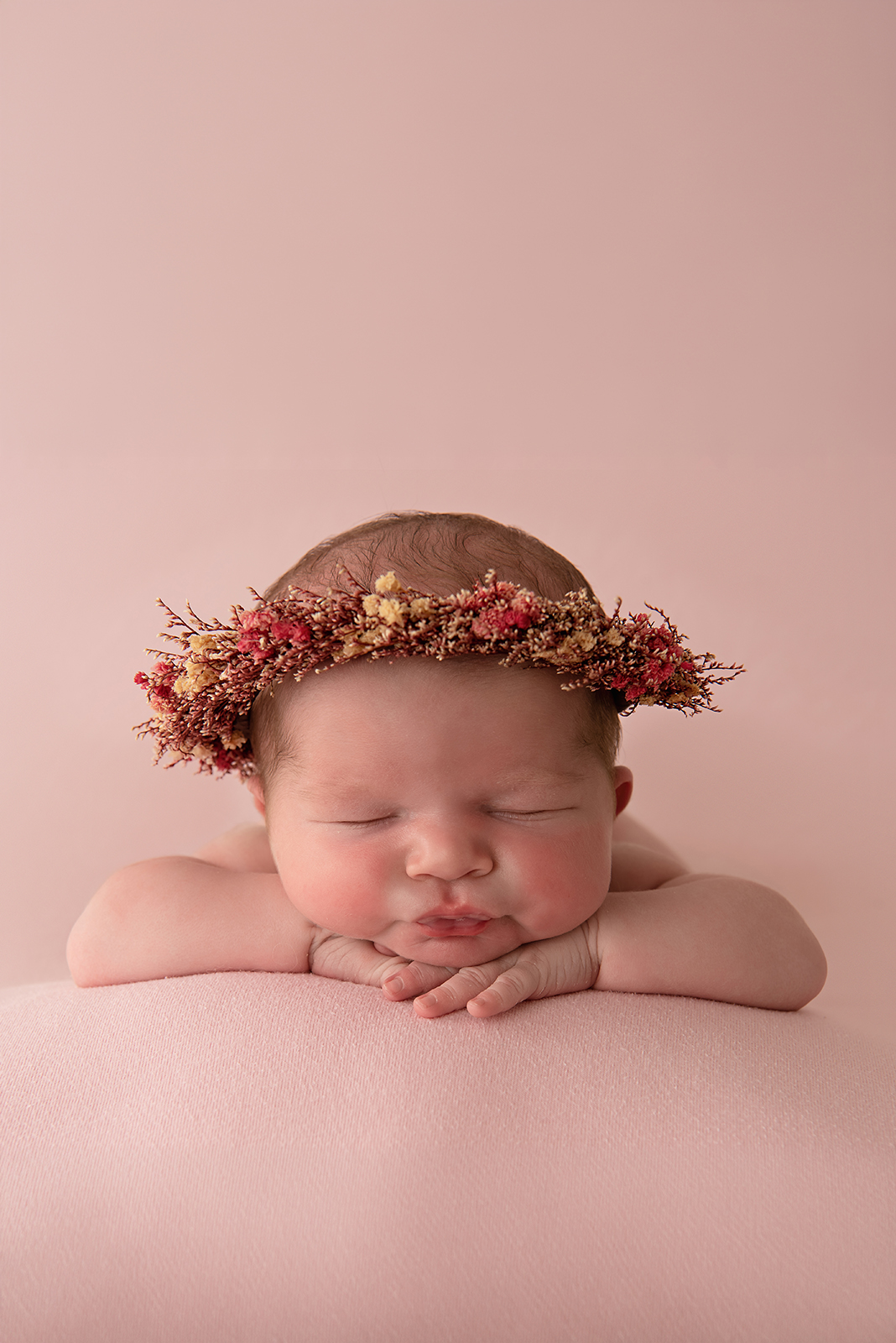 Newborn baby peacefully sleeping in studio