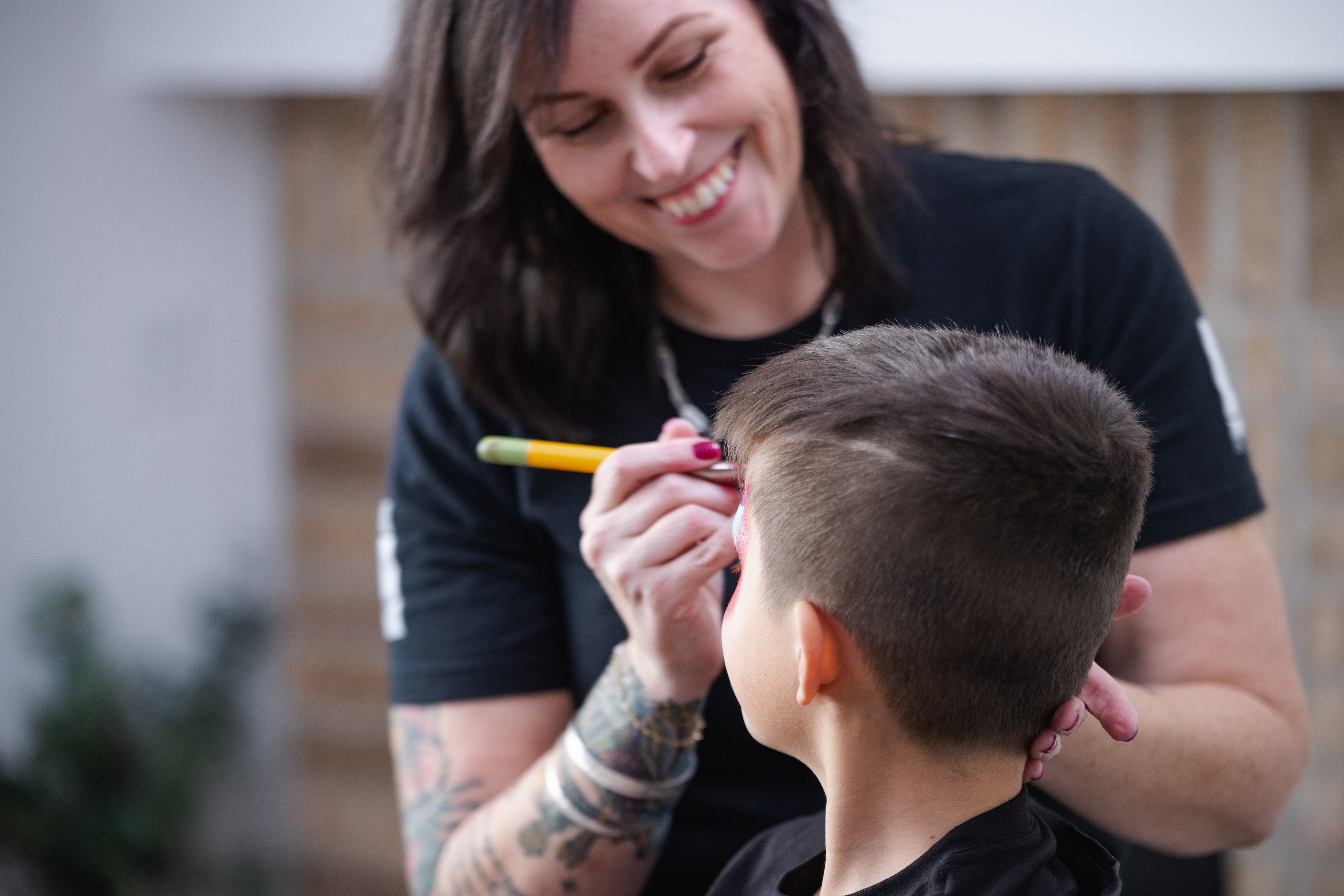 Artists providing upscale face painting at a corporate event