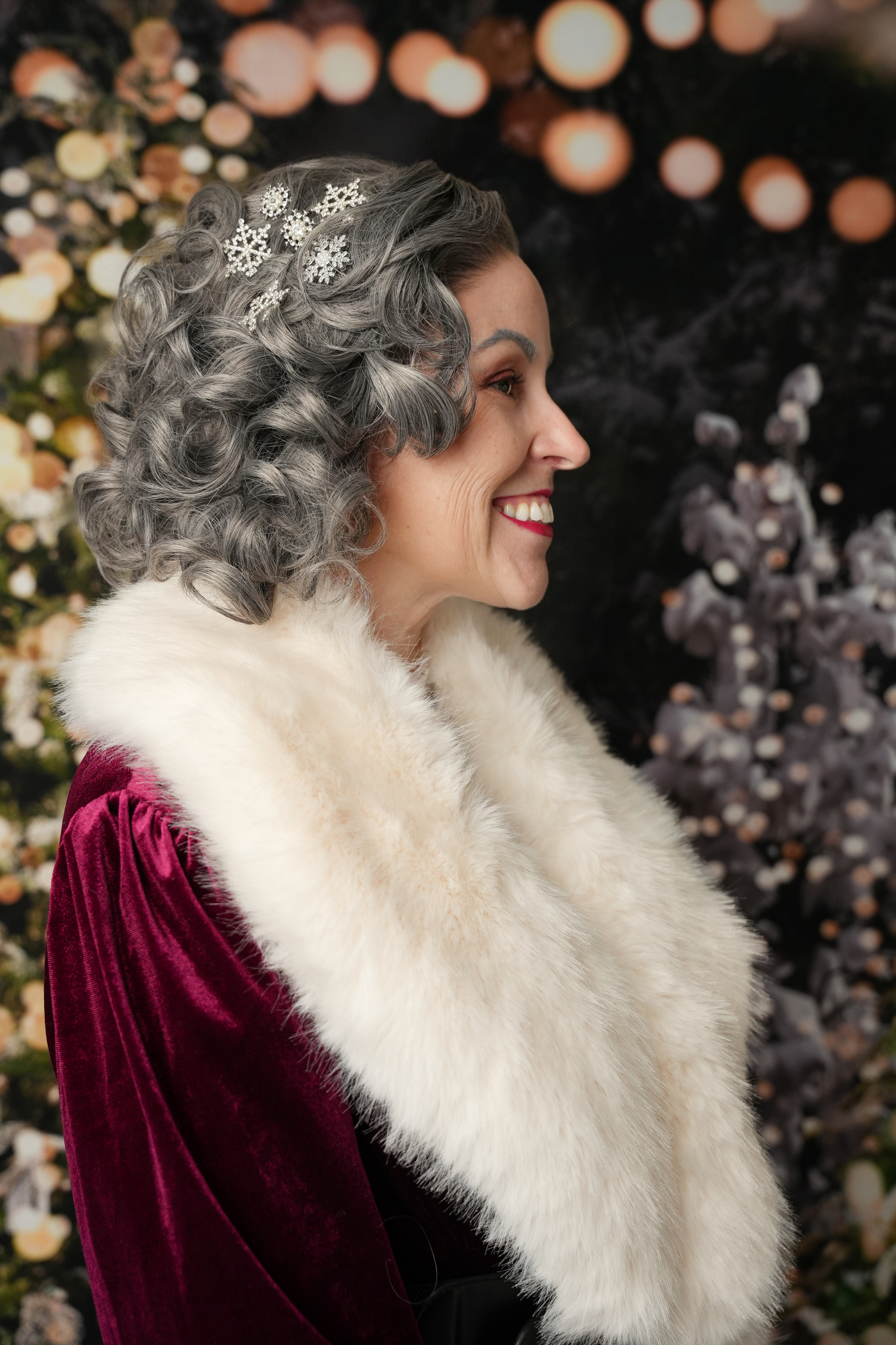 Premium Mrs. Claus engaging with guests at a corporate event