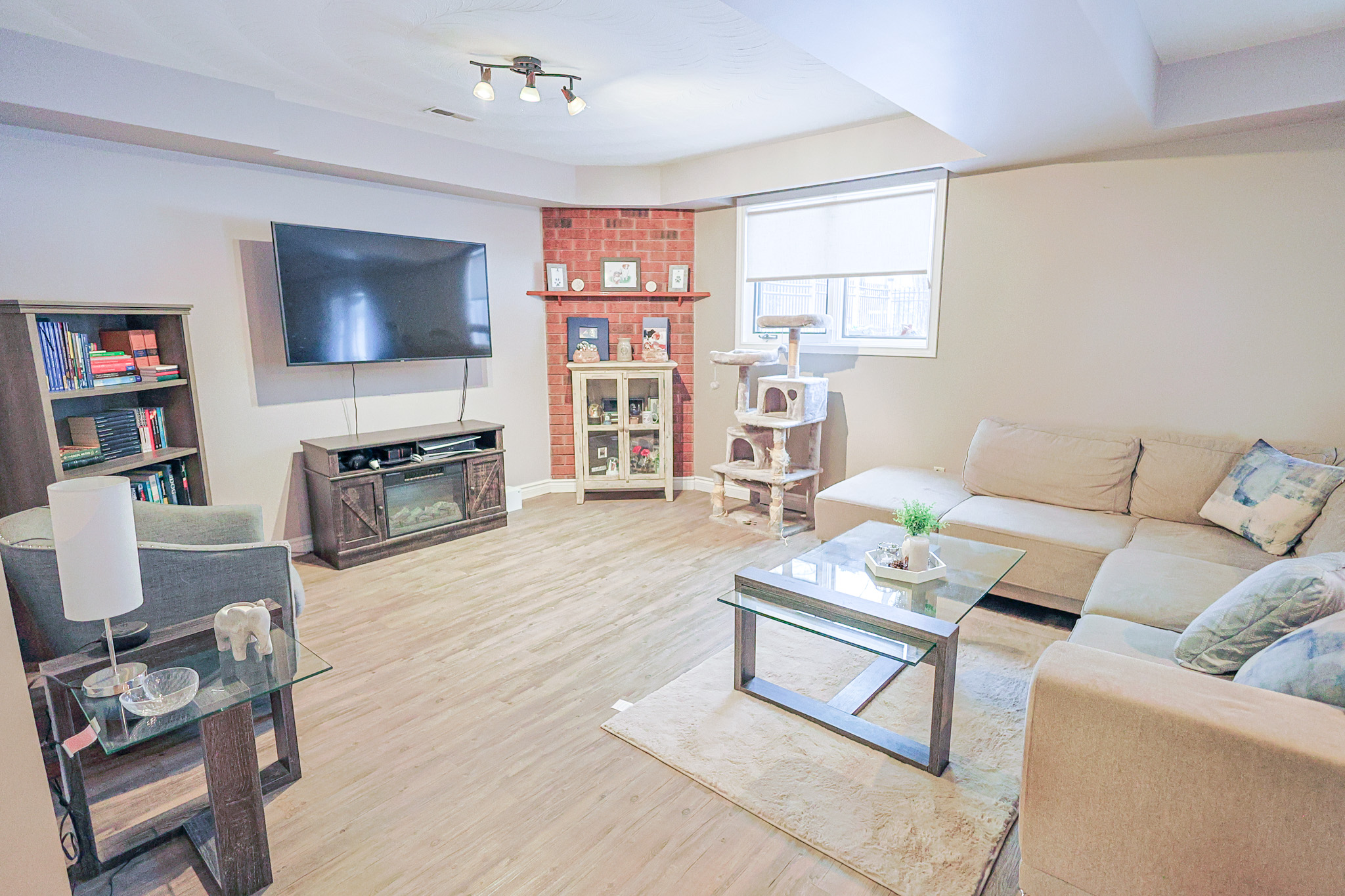 a living room filled with furniture and a kitchen