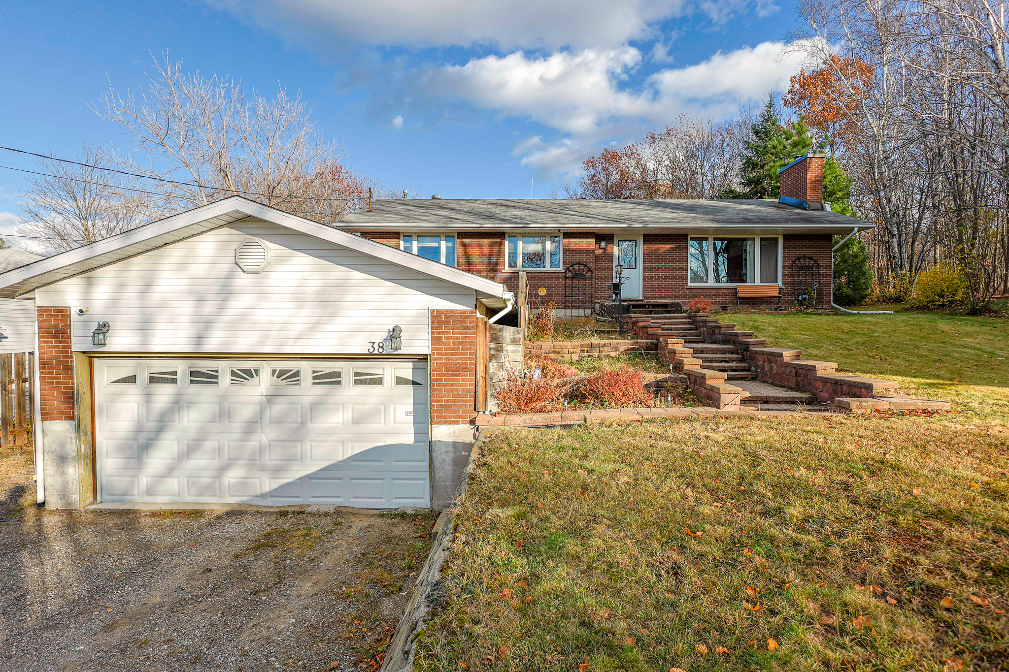 a living room filled with furniture and a kitchen