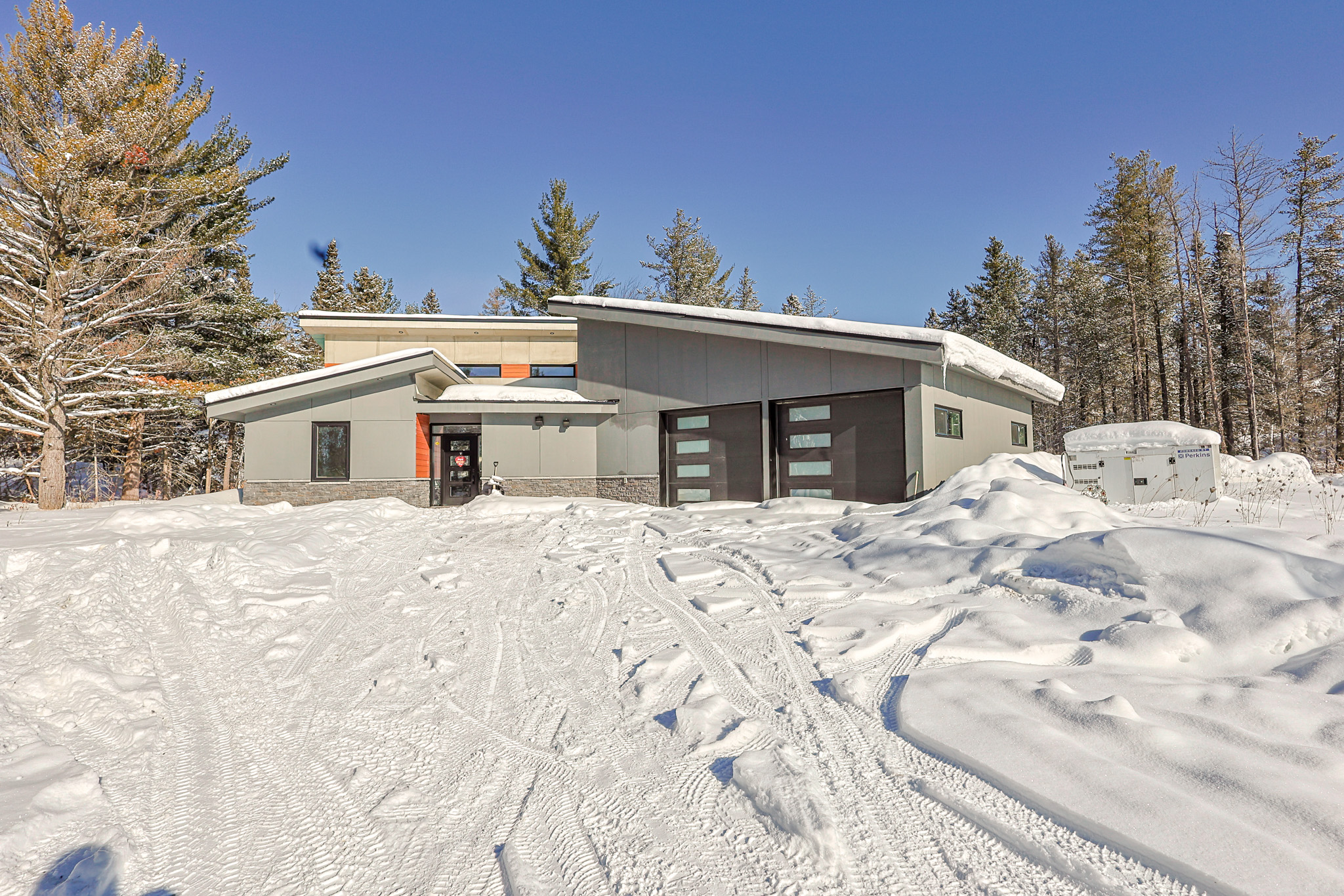 a living room filled with furniture and a kitchen