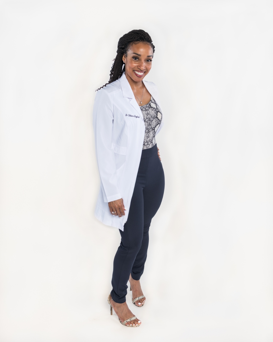 Editorial portrait of Dr. Tahera English in a clinical setting