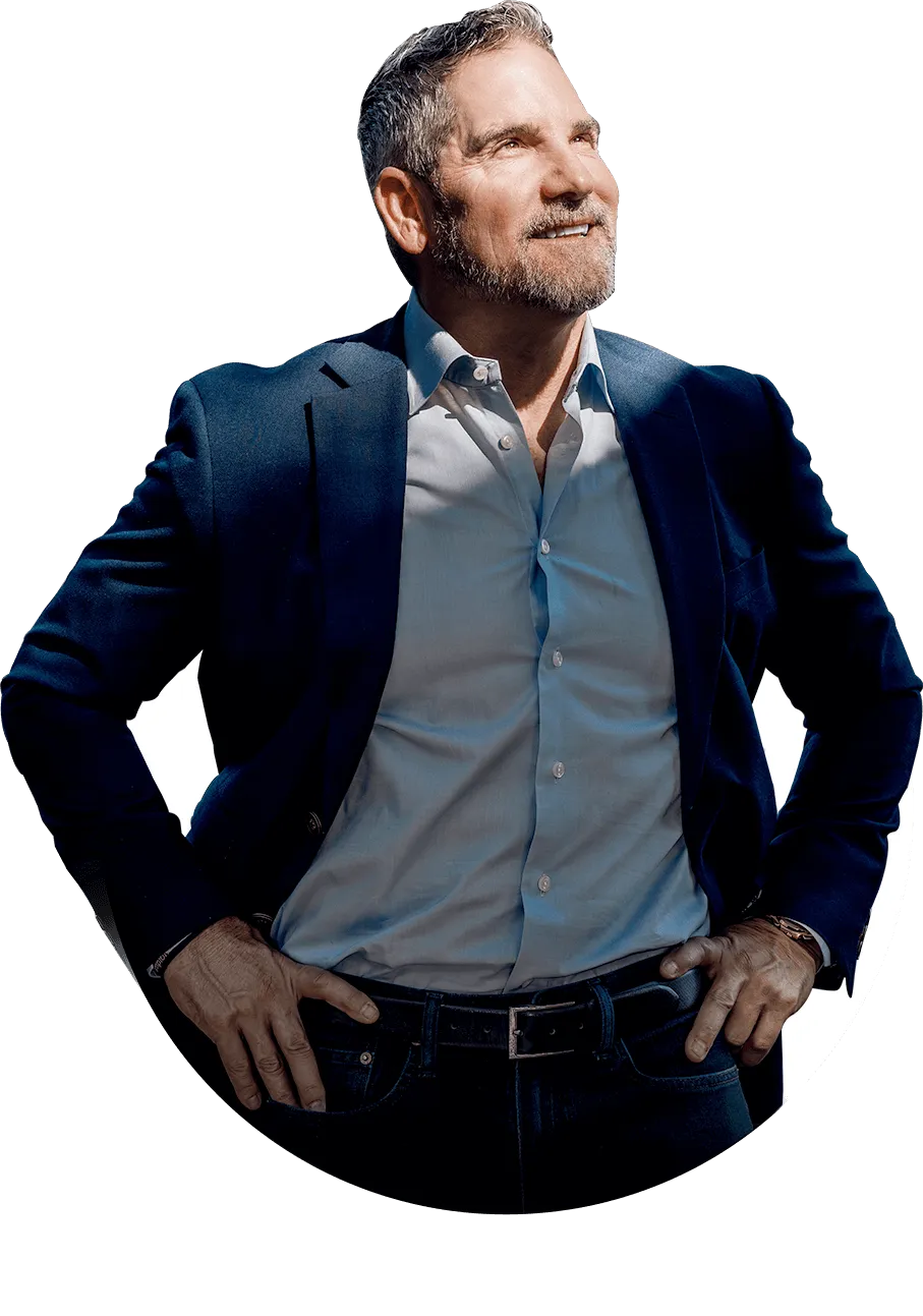 Grant Cardone posing confidently, known for building a $5B multifamily real estate portfolio and teaching others to create financial freedom.