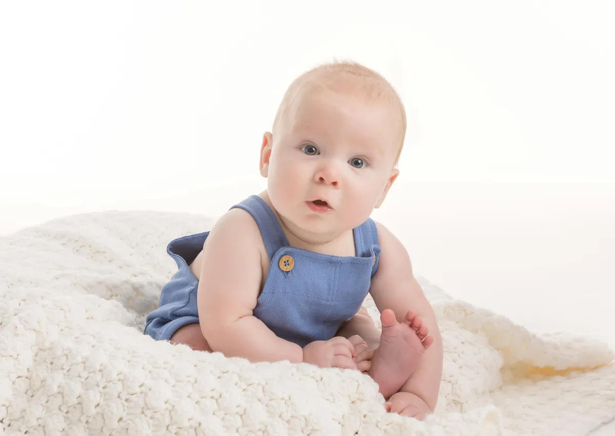 Baby's First Year Milestones Gallery Fine art family portrait in classic neutral tones taken in Raleigh studio