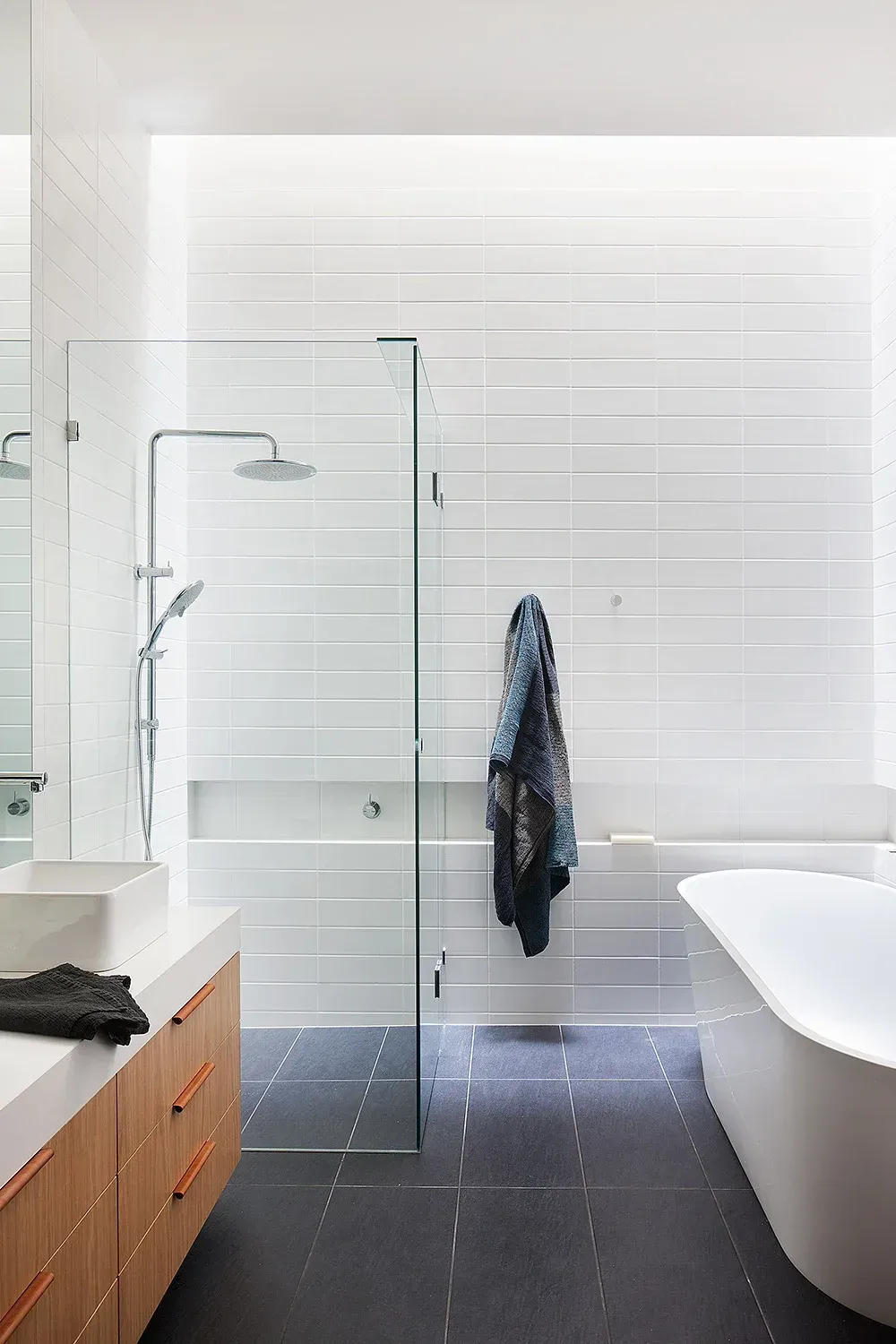 Free standing bath with walk in shower by Team Dunn