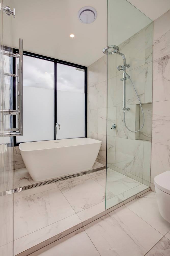 Freestanding bath in bathroom by Team Dunn in Batemans Bay
