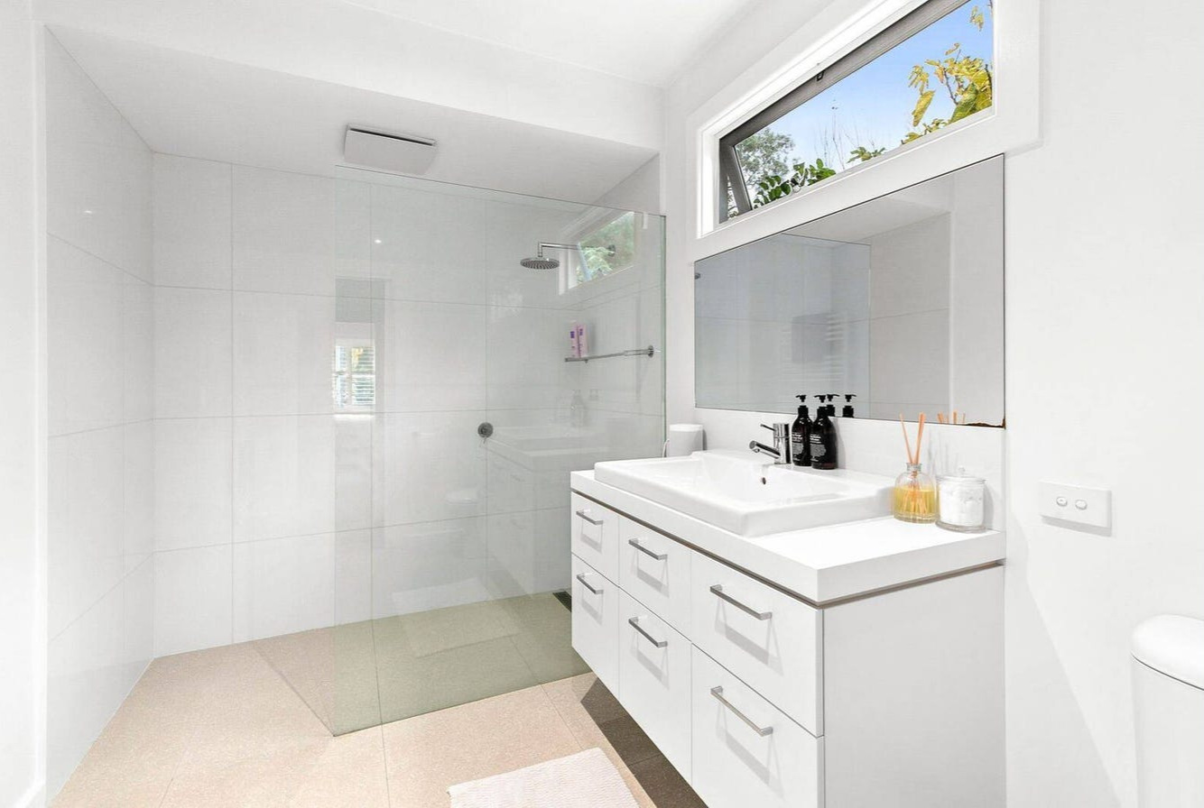 White walkin shower by Team Dunn in Batemans Bay