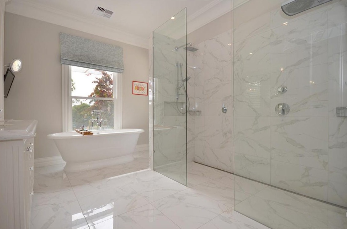 Free standing bath with walk in shower by Team Dunn