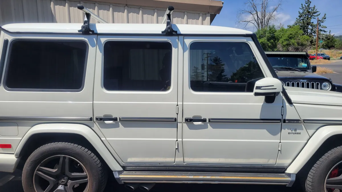 White vehicle with tinted windows showcasing professional window tinting services by Alpha Shielding LLC in Bend, Oregon.
