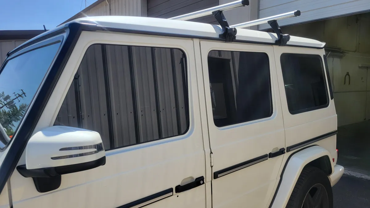 White vehicle with tinted windows showcasing professional window tinting services by Alpha Shielding LLC in Bend, Oregon