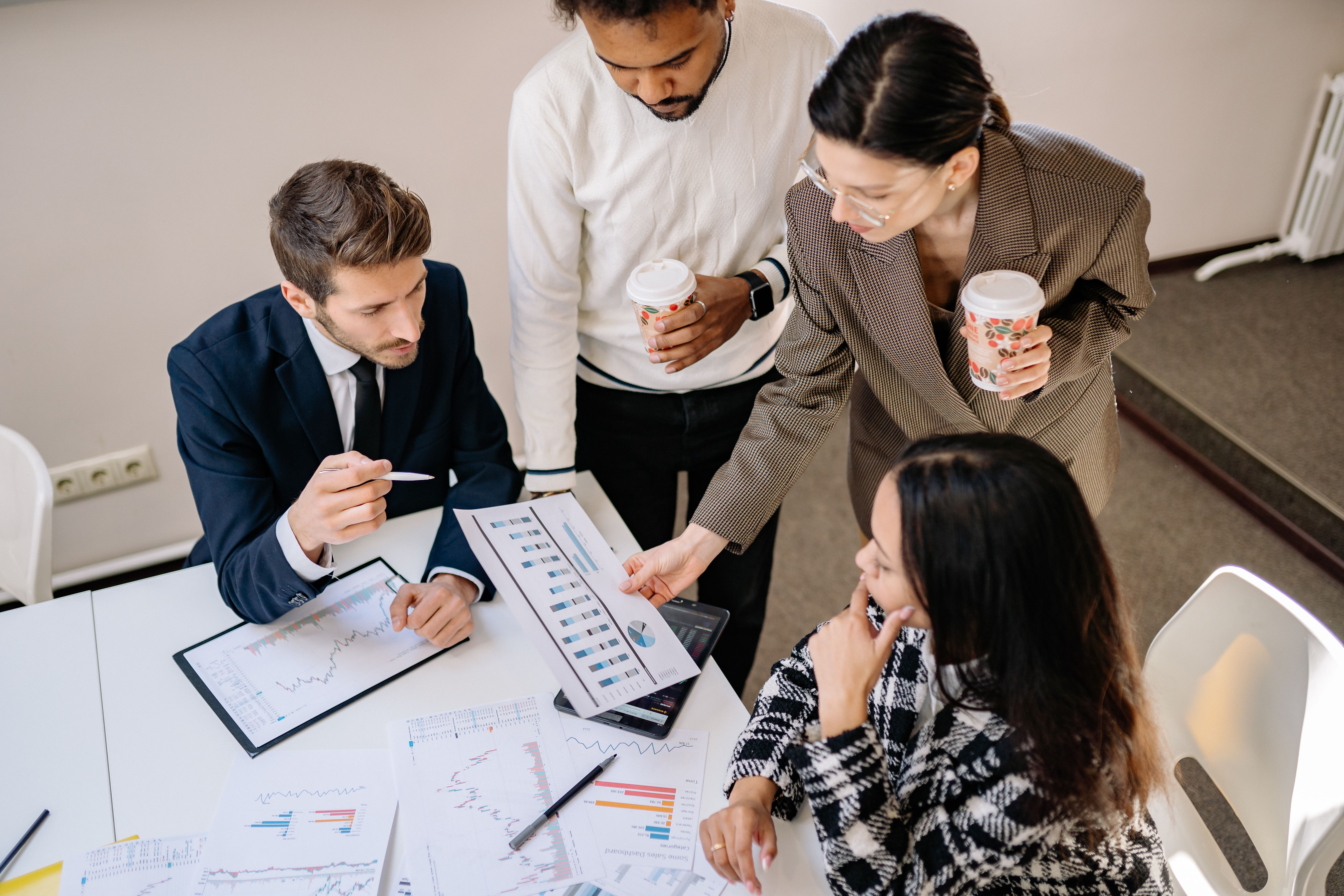 Financial advisor reviewing capital planning strategies and long-term wealth preservation objectives with clients.