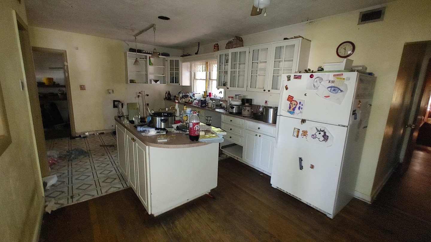 Crew performing a residential interior cleanout and debris removal