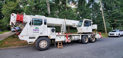 People’s Tree Specialists crane truck staged for difficult-access residential tree work