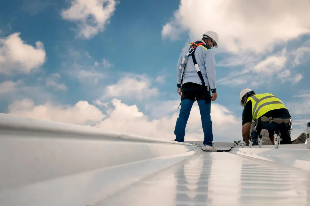 a group of men wearing safety gear