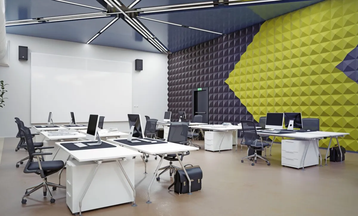 a modern office with white desks, and a large colorful acoustic panel wall