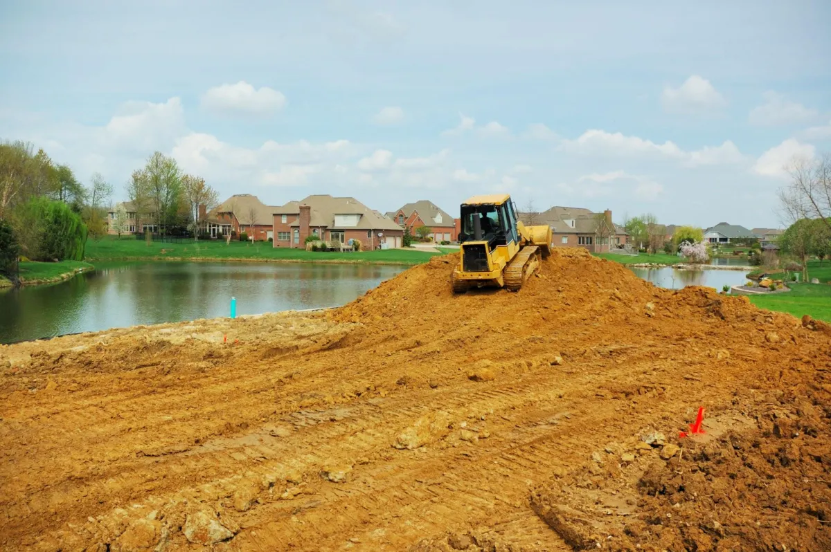 buldozr moving dirt at construction site