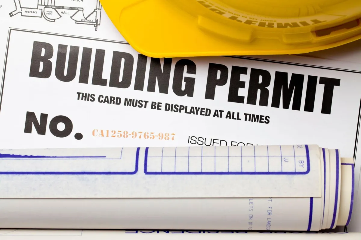 a bilding permit number card at a construction site