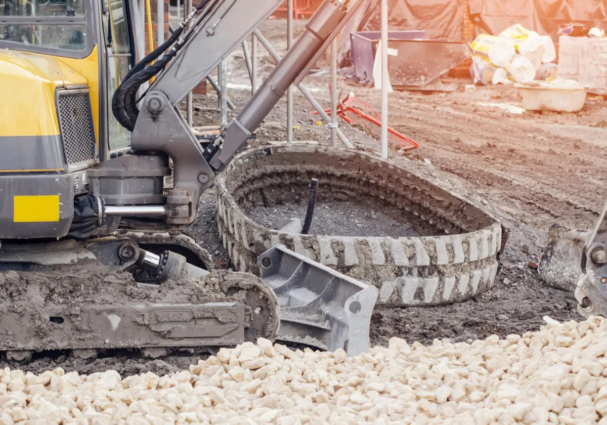 excavator with broken tread