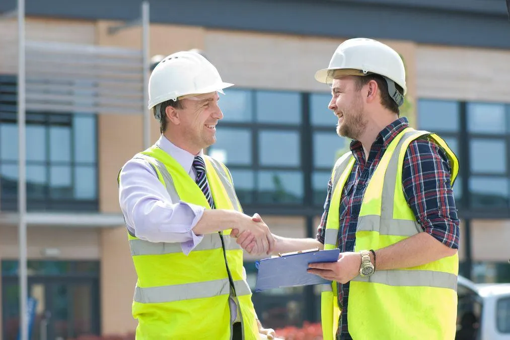 contractor talking with hired sub