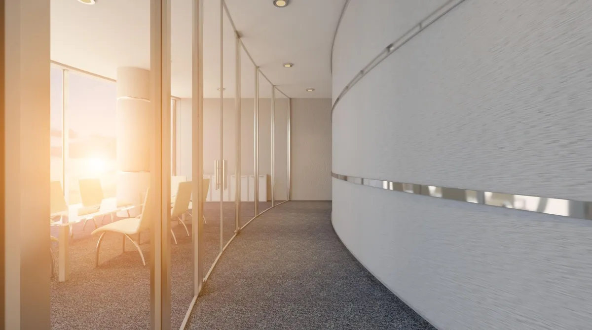an office with open space and curved alls