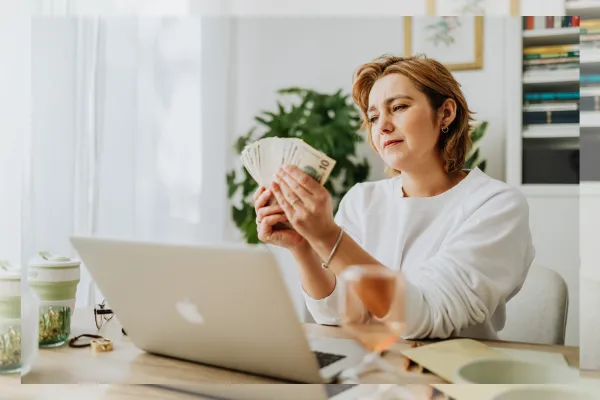 woman entrepreneur reviewing financial reports and making confident business decisions