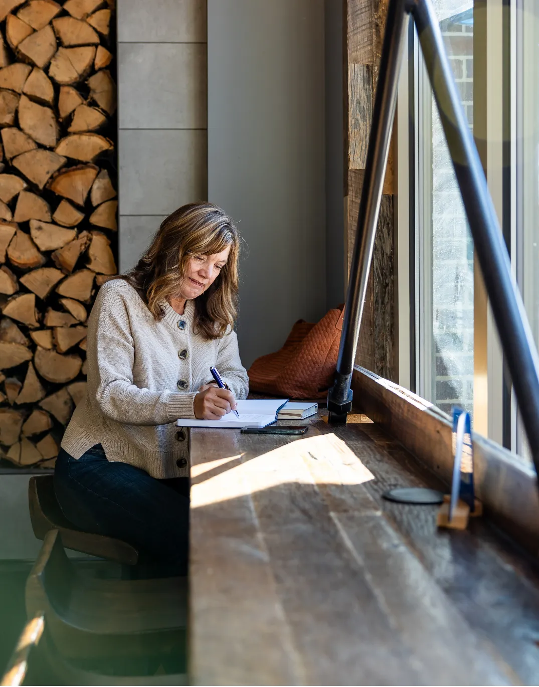 Jennifer Kok, profit and business growth advisor, planning at a table