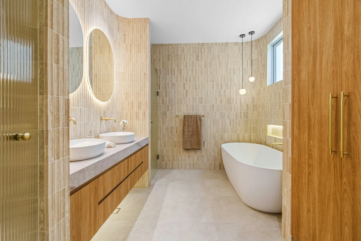 Bathroom with freestanding tub and plants