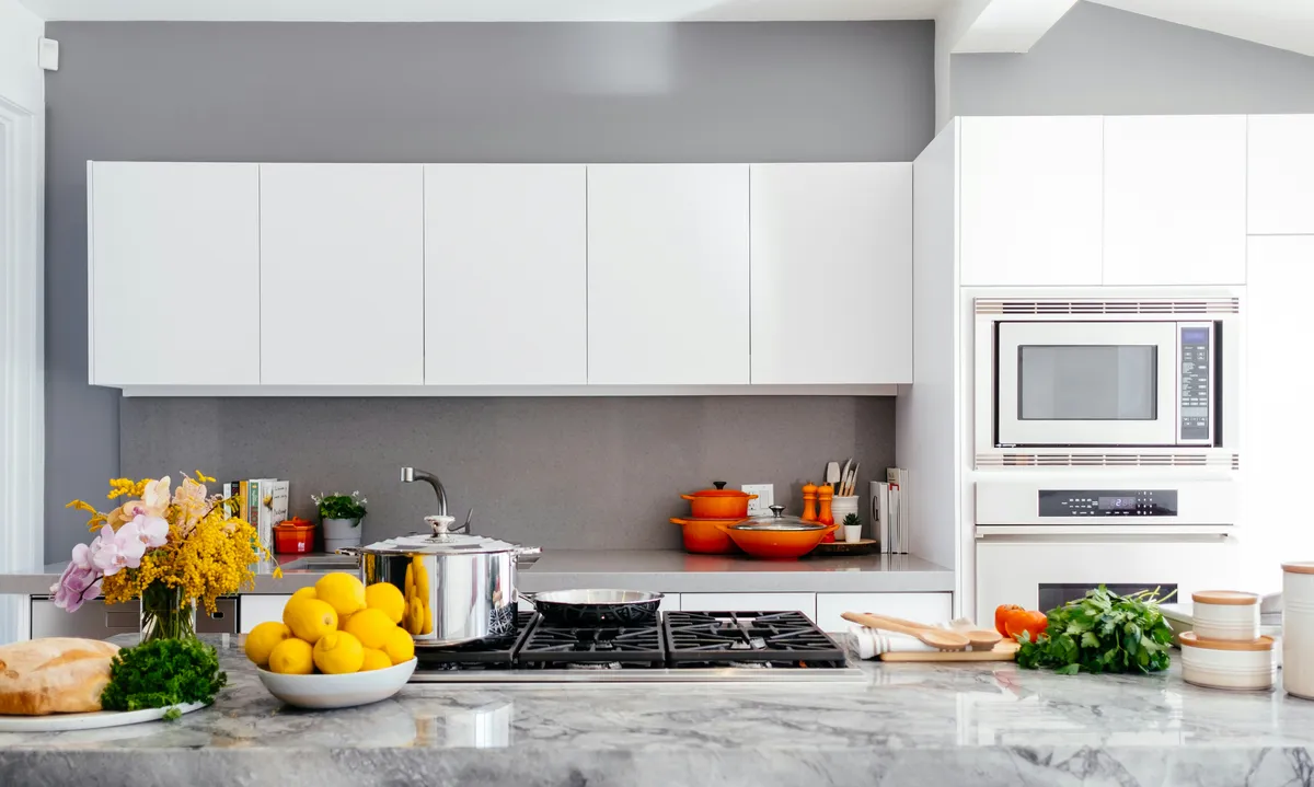 Finished kitchen remodel with new cabinetry and lighting
