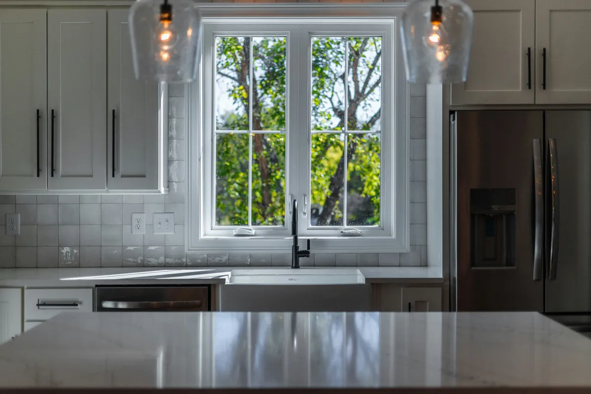 White shaker kitchen with quartz countertops