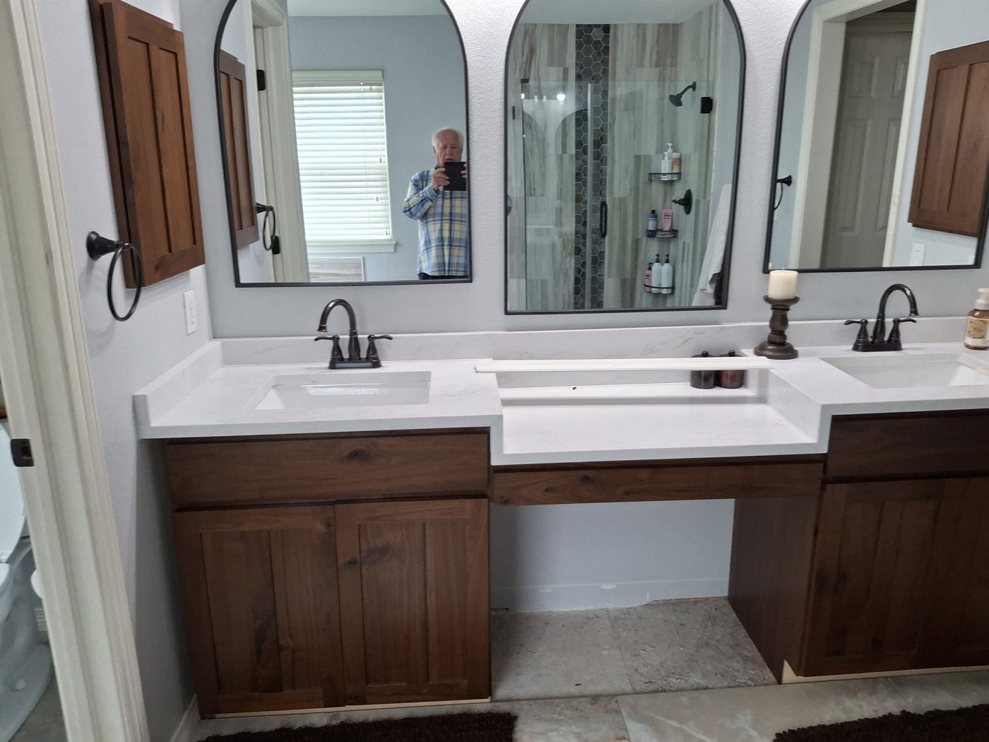 New bathroom vanity with mirrors and modern fixtures