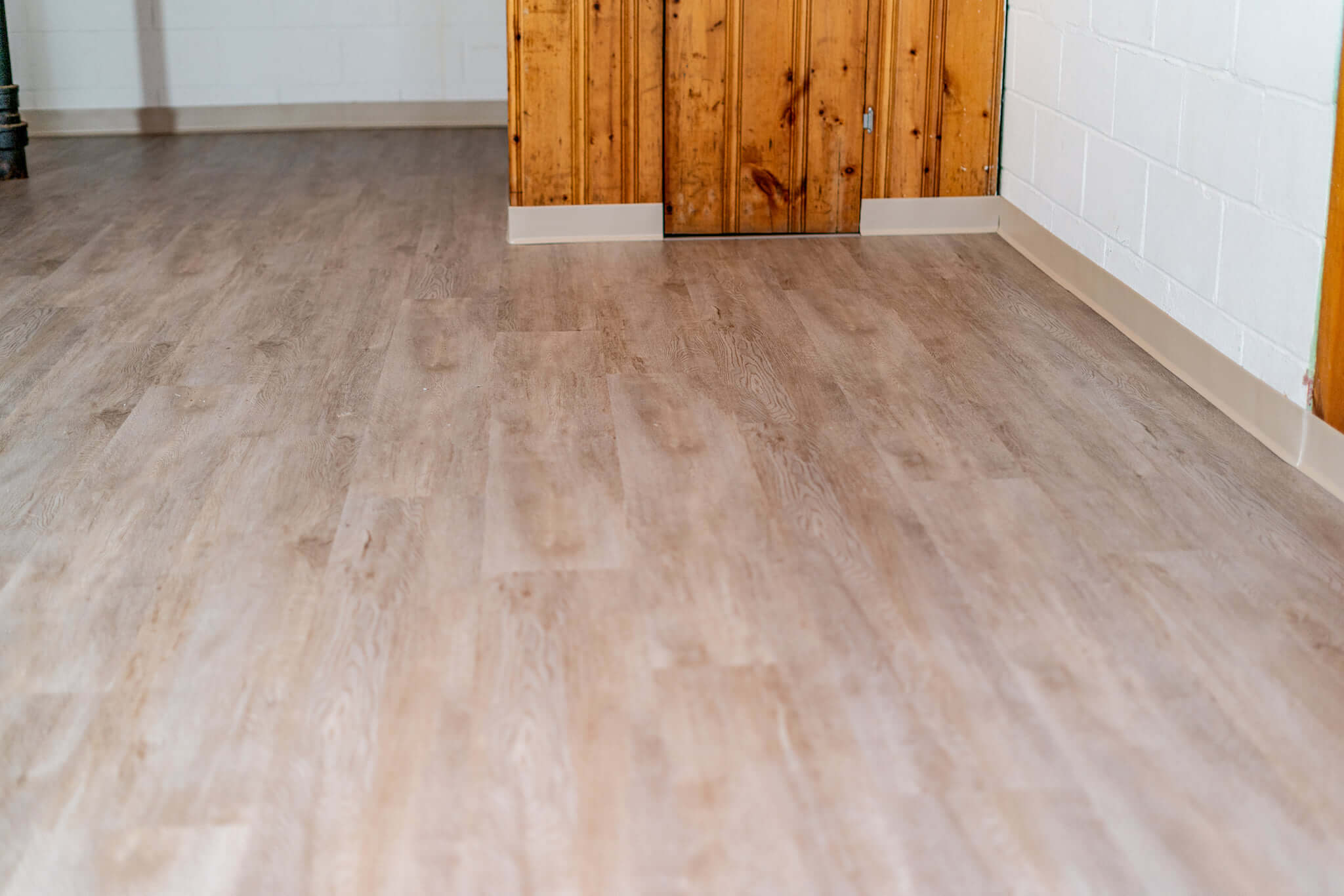 Modern dining and living area with large windows.