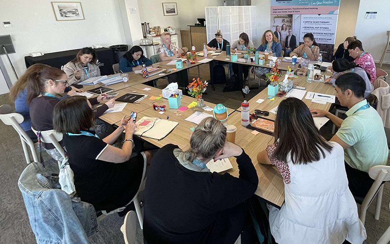 Elicia facilitating a round table day for massage business owners