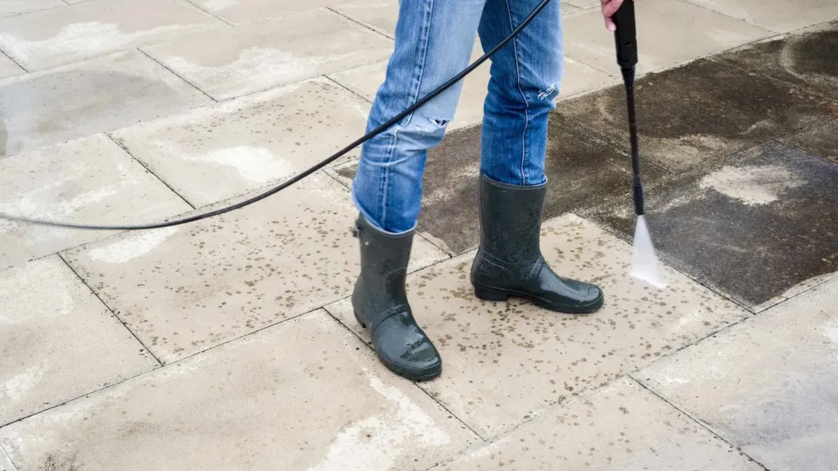 pressure washing Santa Rosa, CA — technician cleaning a concrete driveway with a surface cleaner — A & J Yard Service