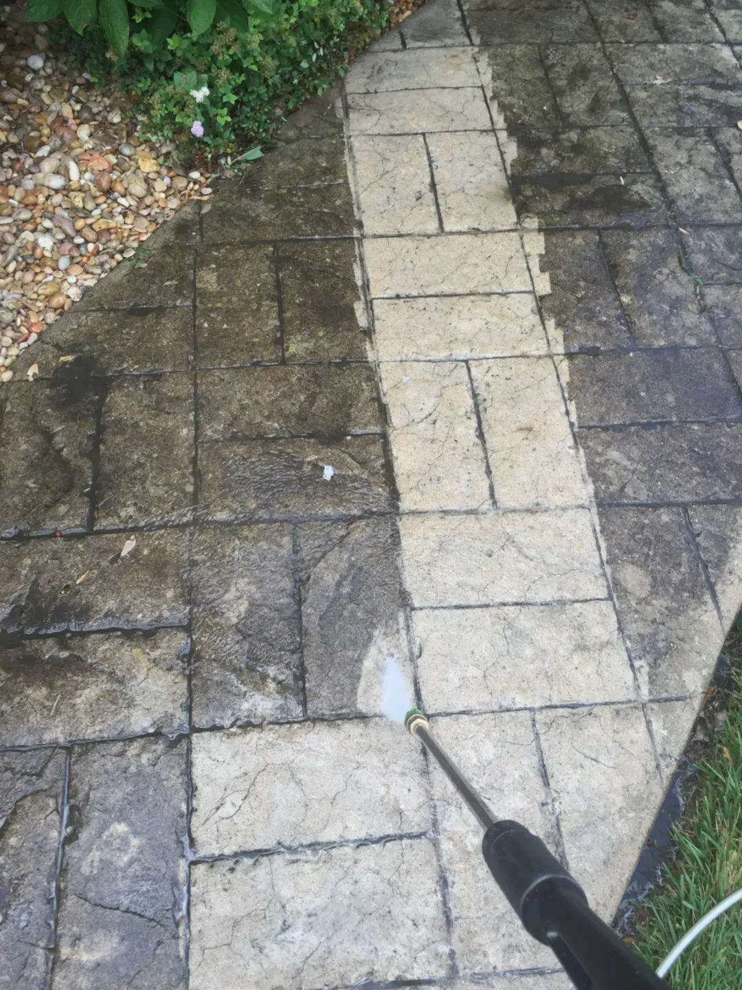 Pressure washing the side of a homes siding