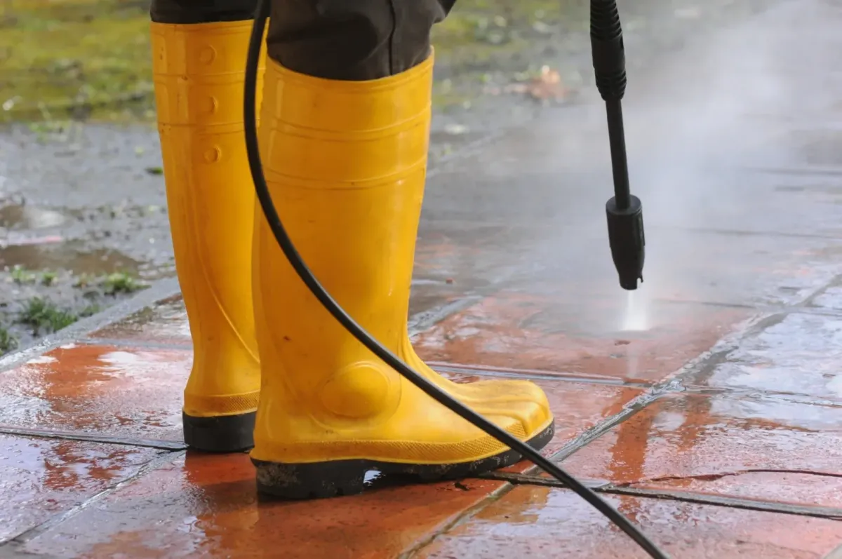 pressure washing Rohnert Park, CA — technician surface cleaning driveway — A & J Yard Service