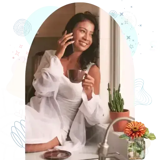 Woman speaking on the phone offering gentle customer support on the Evelyn Foreman contact page