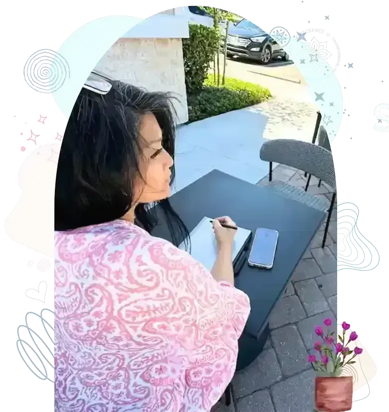 Rev. Evelyn Foreman sitting on a chair for the About page — radiating warmth, calm presence, and the sacred essence of mindful living