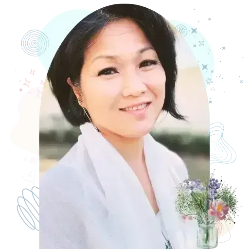 Rev. Evelyn Foreman smiling in a white dress for the About page — a portrait reflecting warmth, compassion, and spiritual presence.