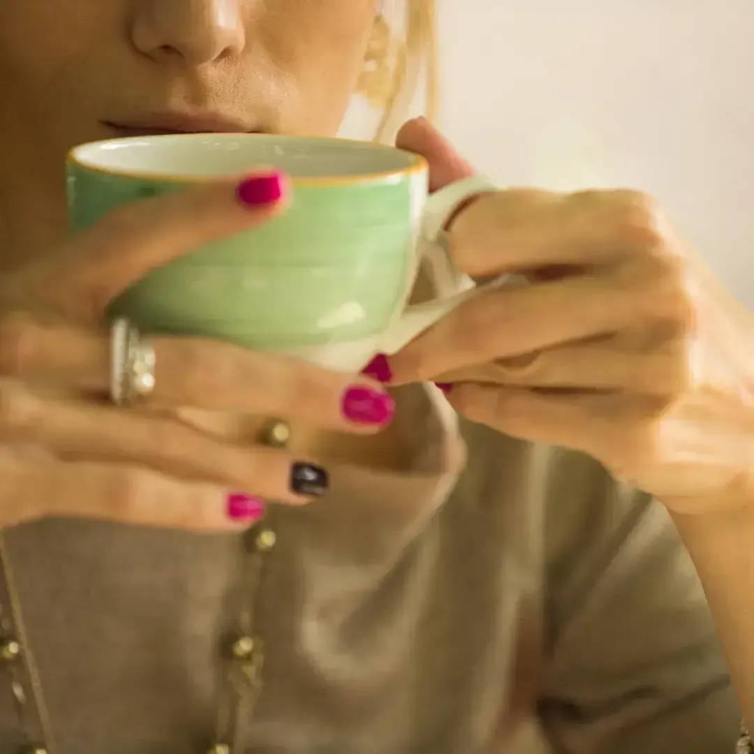 Everyday Sacred 49-Day funnel call-to-action image showing a woman sipping coffee and inviting visitors to join the waitlist and receive an exclusive bonus