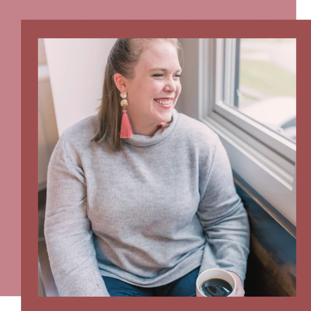 Twin Cities Birth Doula, Jillian Carpenter, sitting by a window drinking coffee.