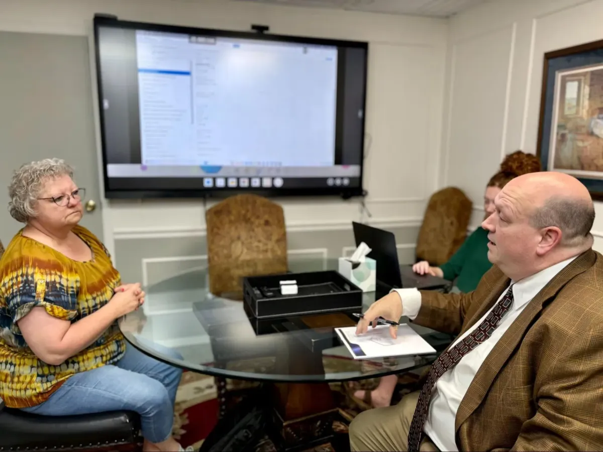 Wills and trusts attorney reviewing documents with a Valley Center Kansas