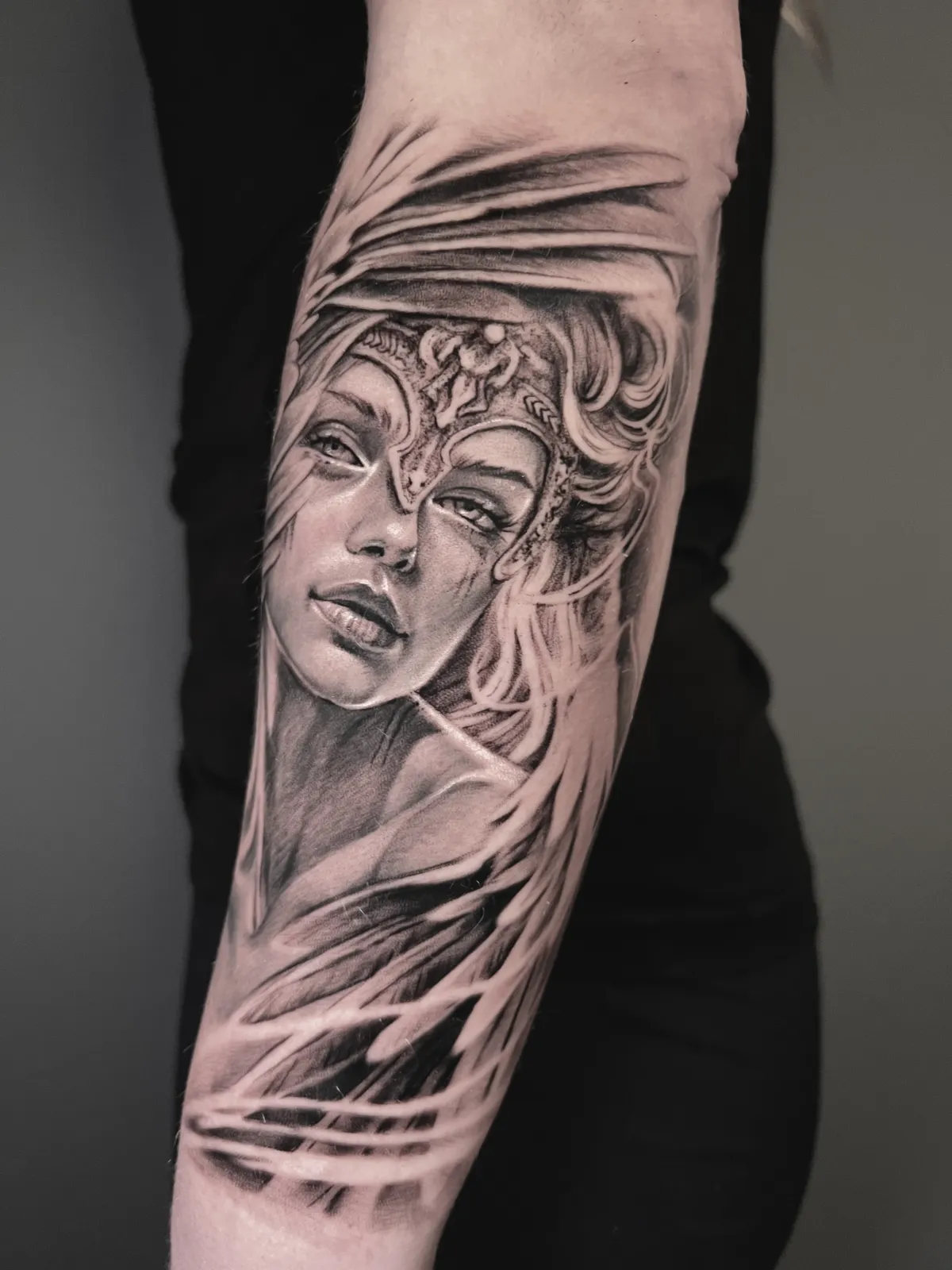 person with tattoo on right arm