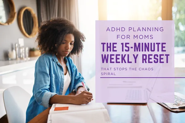 Black women writing in a note book.