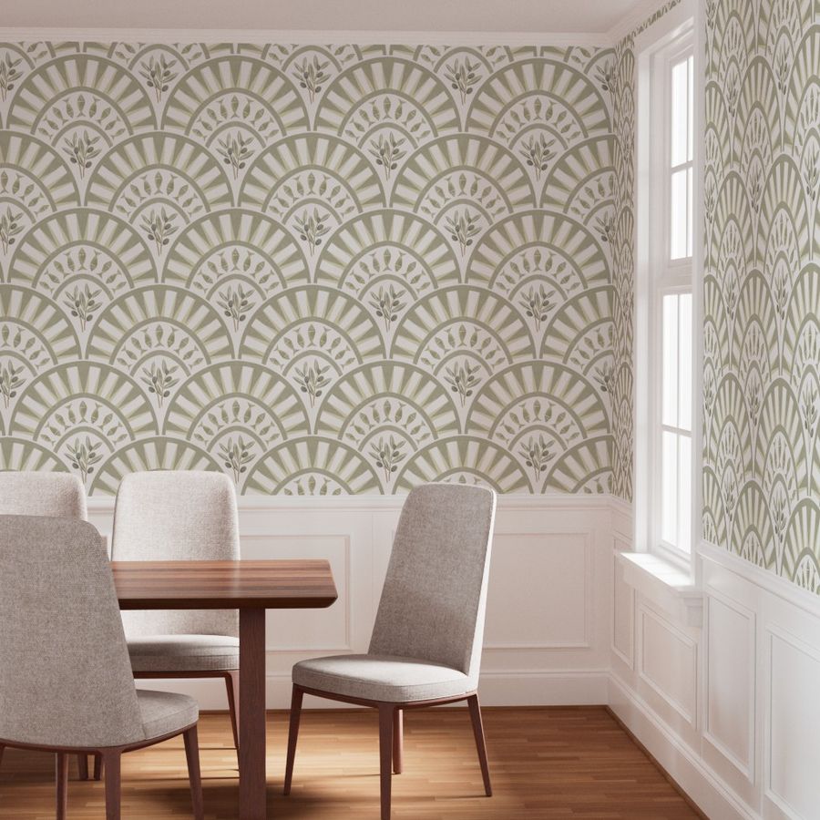 Muted sage and ivory Art Deco botanical wallpaper used as a dining room feature wall with geometric fan arches and leafy details.
