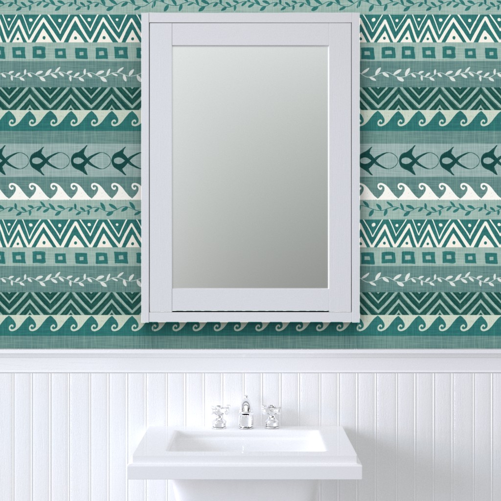 Teal and cream coastal geometric stripe wallpaper with waves, chevrons, vines, squares, and abstract fish in a white bathroom.