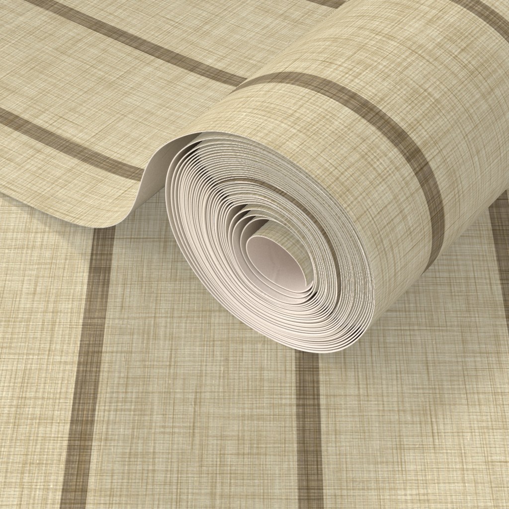 Rolled warm beige grasscloth wallpaper with dark taupe stripes, showing the linen-like surface and stripe detail at close range.